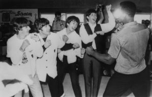 22nd February 1964: British pop group The Beatles, from left to right; Ringo Starr, John Lennon (1940 - 1980), George Harrison (1943 - 2001) and Paul McCartney; in the ring with champion American boxer Cassius Clay, whilst in Miami. (Photo by Keystone/Getty Images)